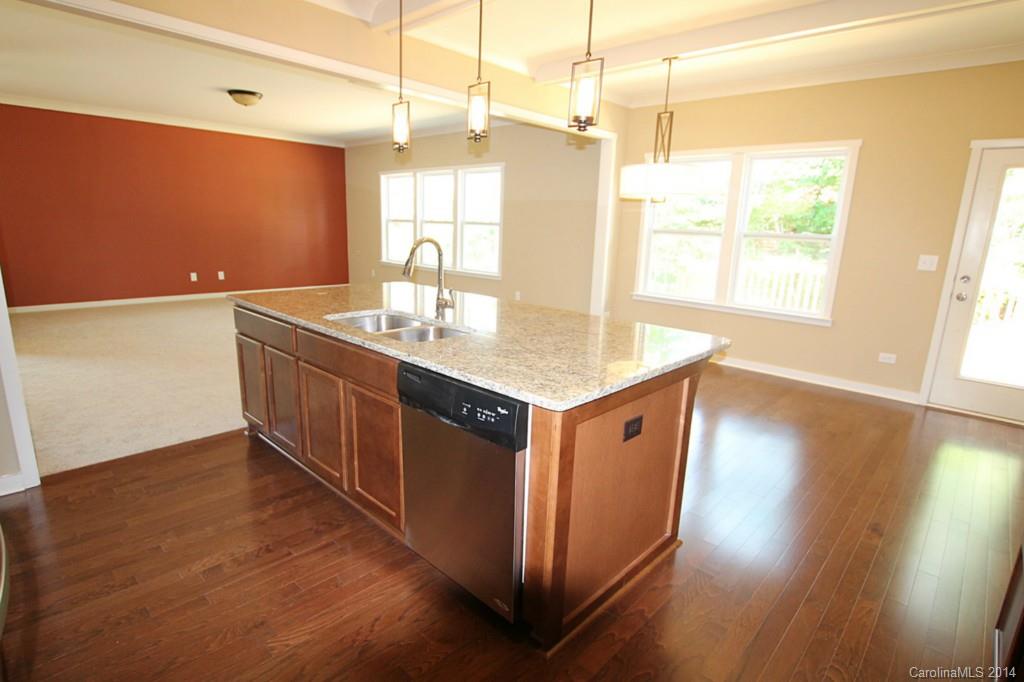 7140 Meyer Road, Unit 309 Fort Mill, SC 29715 - Photo 6 of 16 a hall with wooden floor a sink and a window
