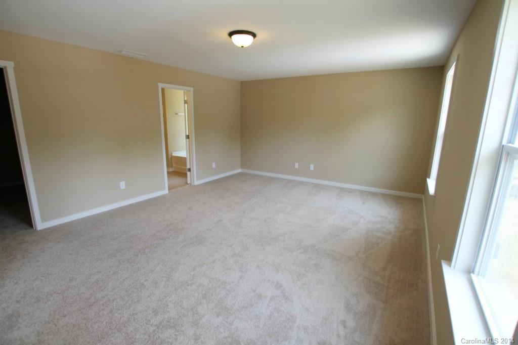 7140 Meyer Road, Unit 309 Fort Mill, SC 29715 - Photo 9 of 16 an empty room with windows