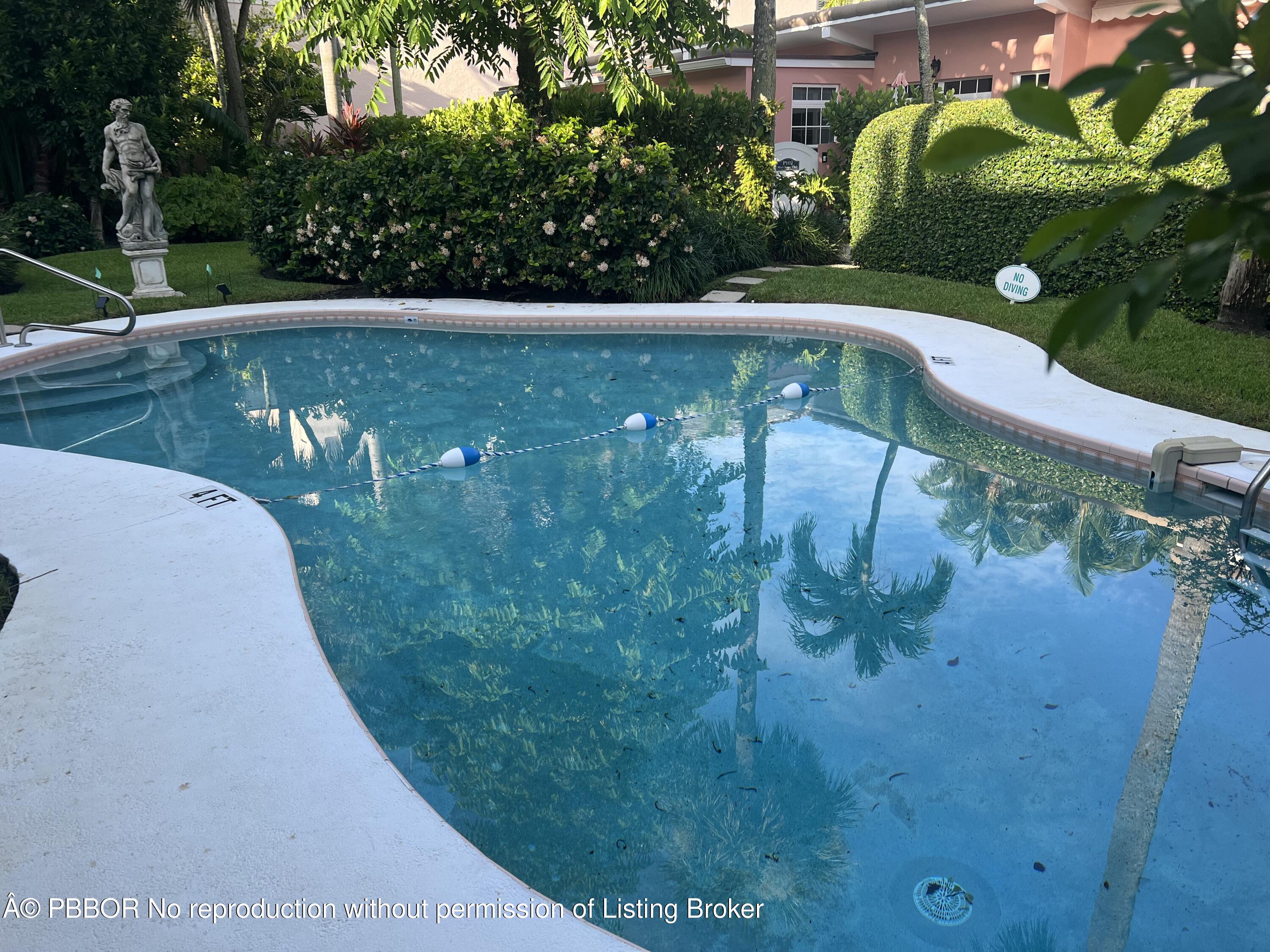 142 Peruvian Avenue, Unit 101 Palm Beach, FL 33480 - Photo 4 of 4 a view of a lake in a backyard