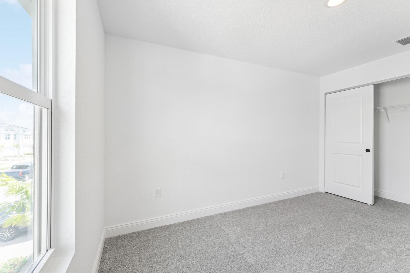165 Southeast Birch Terrace, Unit 842 Stuart, FL 34997 - Photo 20 of 28 a view of an empty room and a window