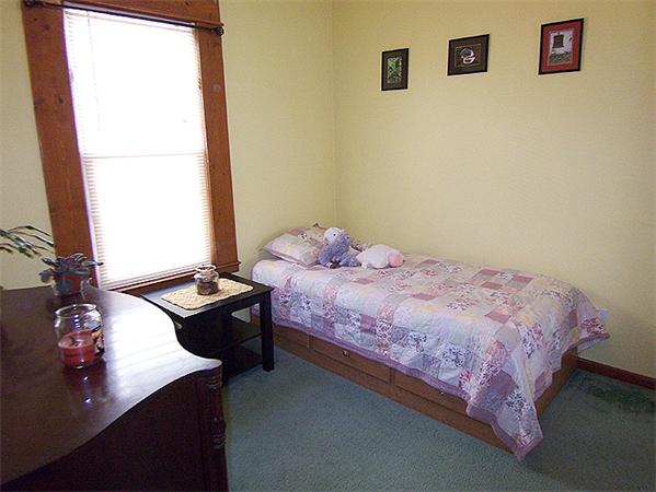 76 Sterling Street Springfield, MA 01107 - Photo 12 of 15 a bedroom with a bed and a window