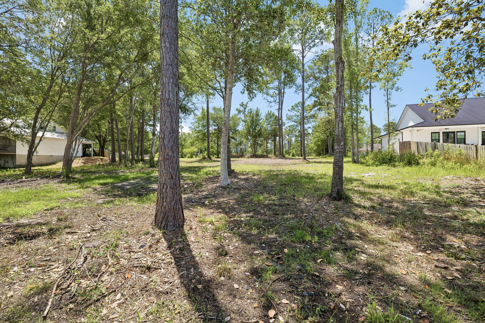 92 Waterside Lane Freeport, FL 32439 - Photo 22 of 28 a backyard of a house with lots of green space