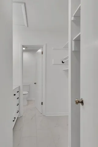 a bathroom with a granite countertop sink and shower