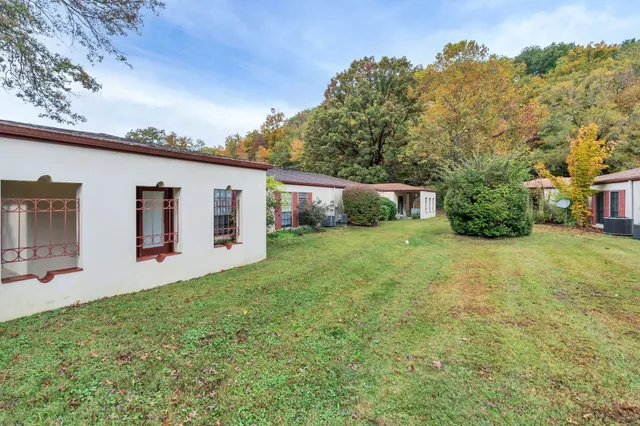 a backyard of a house with lots of green space