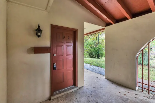 a view of a hallway with a outdoor space