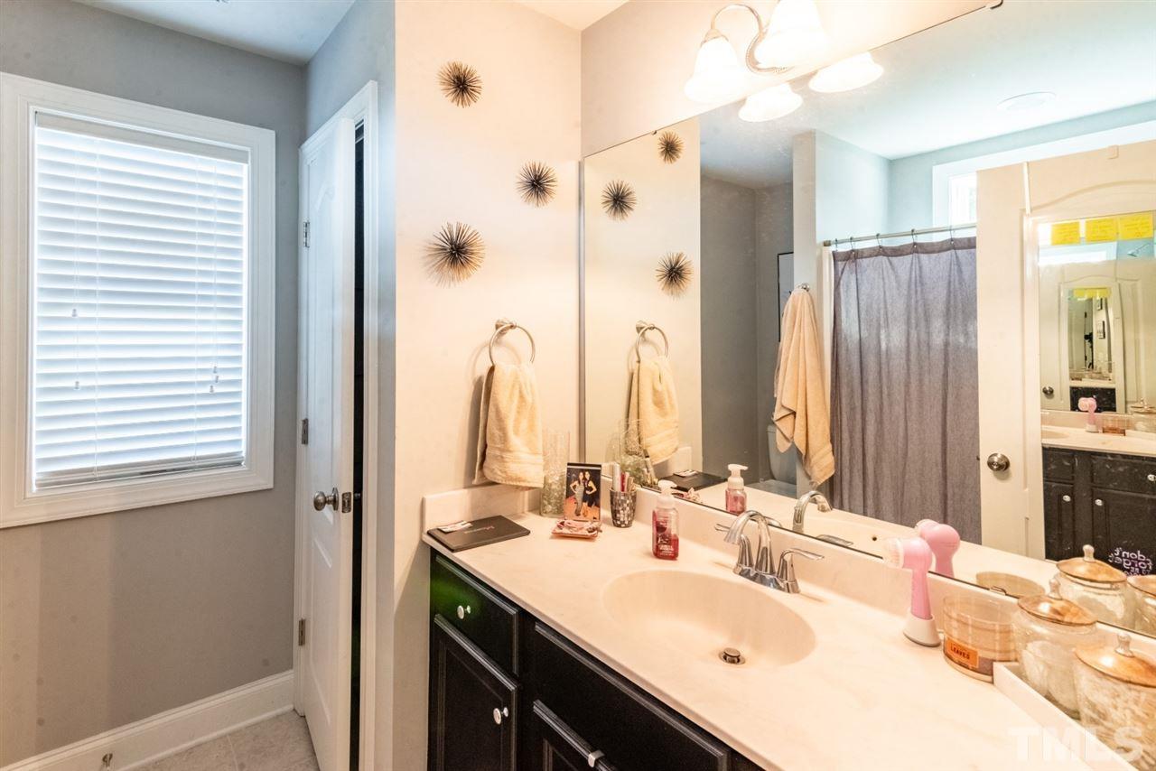 914 Chaney Road Raleigh, NC 27606 - Photo 13 of 15 a bathroom with a double vanity sink mirror and double