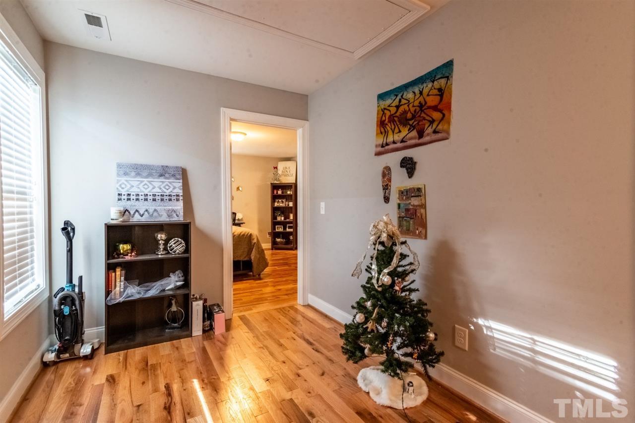 914 Chaney Road Raleigh, NC 27606 - Photo 14 of 15 a room with furniture and a potted plant