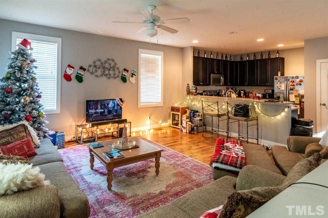 914 Chaney Road Raleigh, NC 27606 - Photo 3 of 15 a living room with furniture kitchen and a potted plant