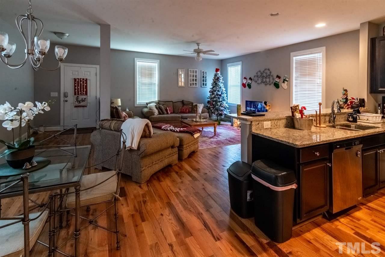 914 Chaney Road Raleigh, NC 27606 - Photo 8 of 15 a living room with furniture and wooden floor