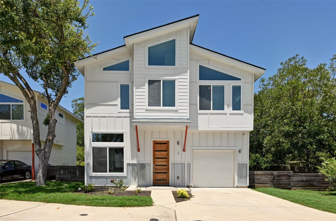 2512 Wheless Lane, Unit 2 Austin, TX 78723 - Photo 1 of 1 a front view of a house with a yard