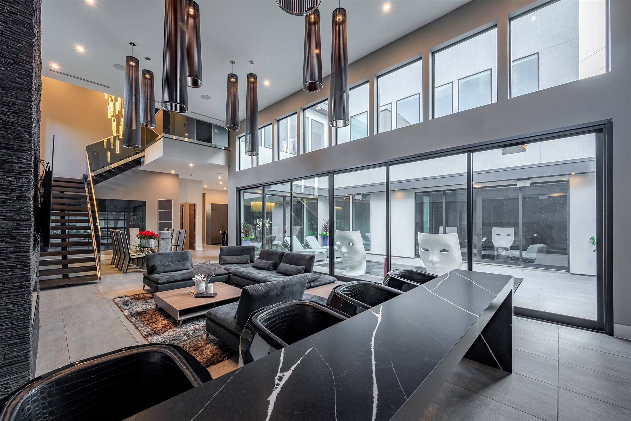 2302 Suffolk Drive Houston, TX 77027 - Photo 17 of 42 a living room with furniture a floor to ceiling window and entryway