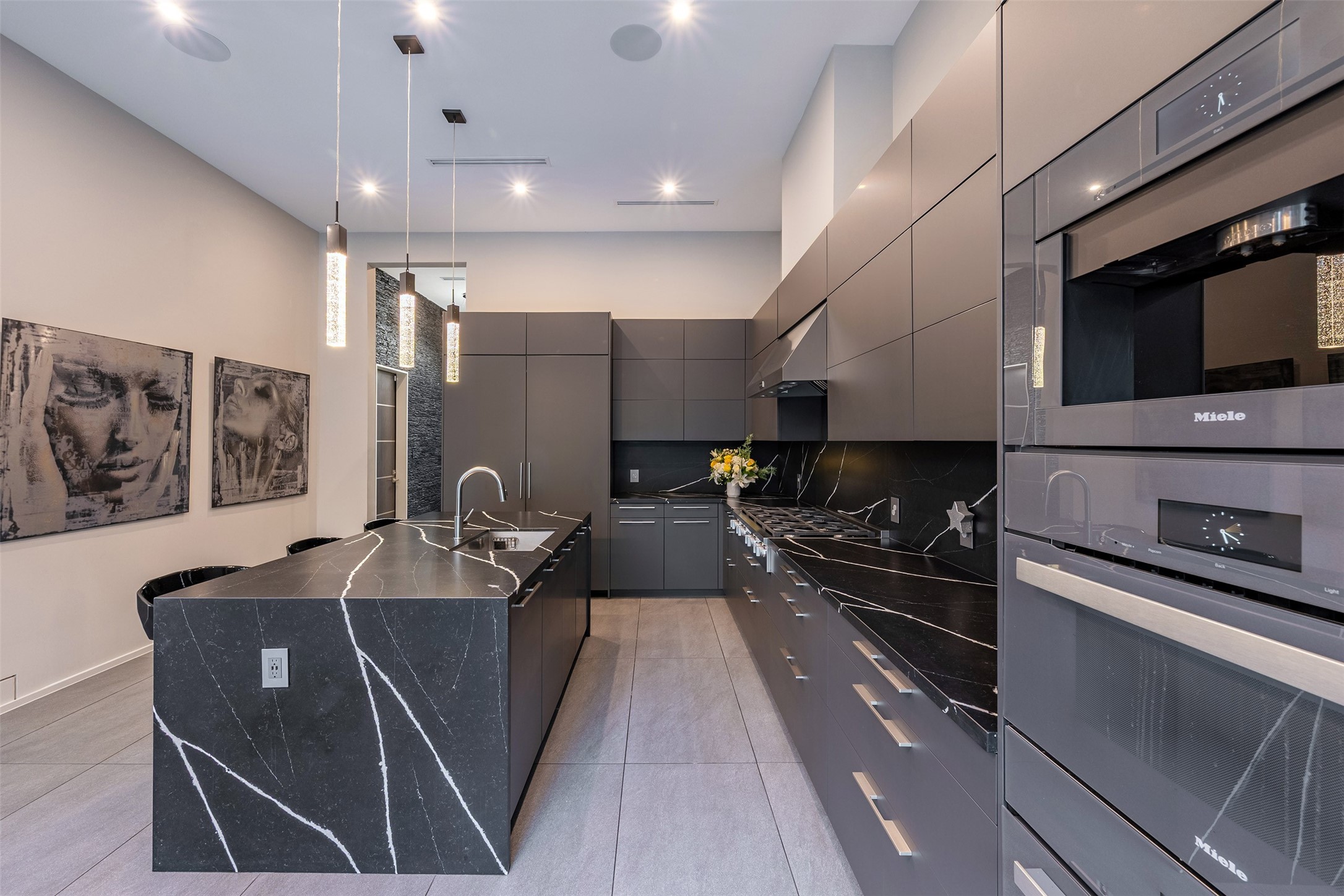 2302 Suffolk Drive Houston, TX 77027 - Photo 20 of 42 a kitchen with stainless steel appliances granite countertop a sink a stove and a microwave