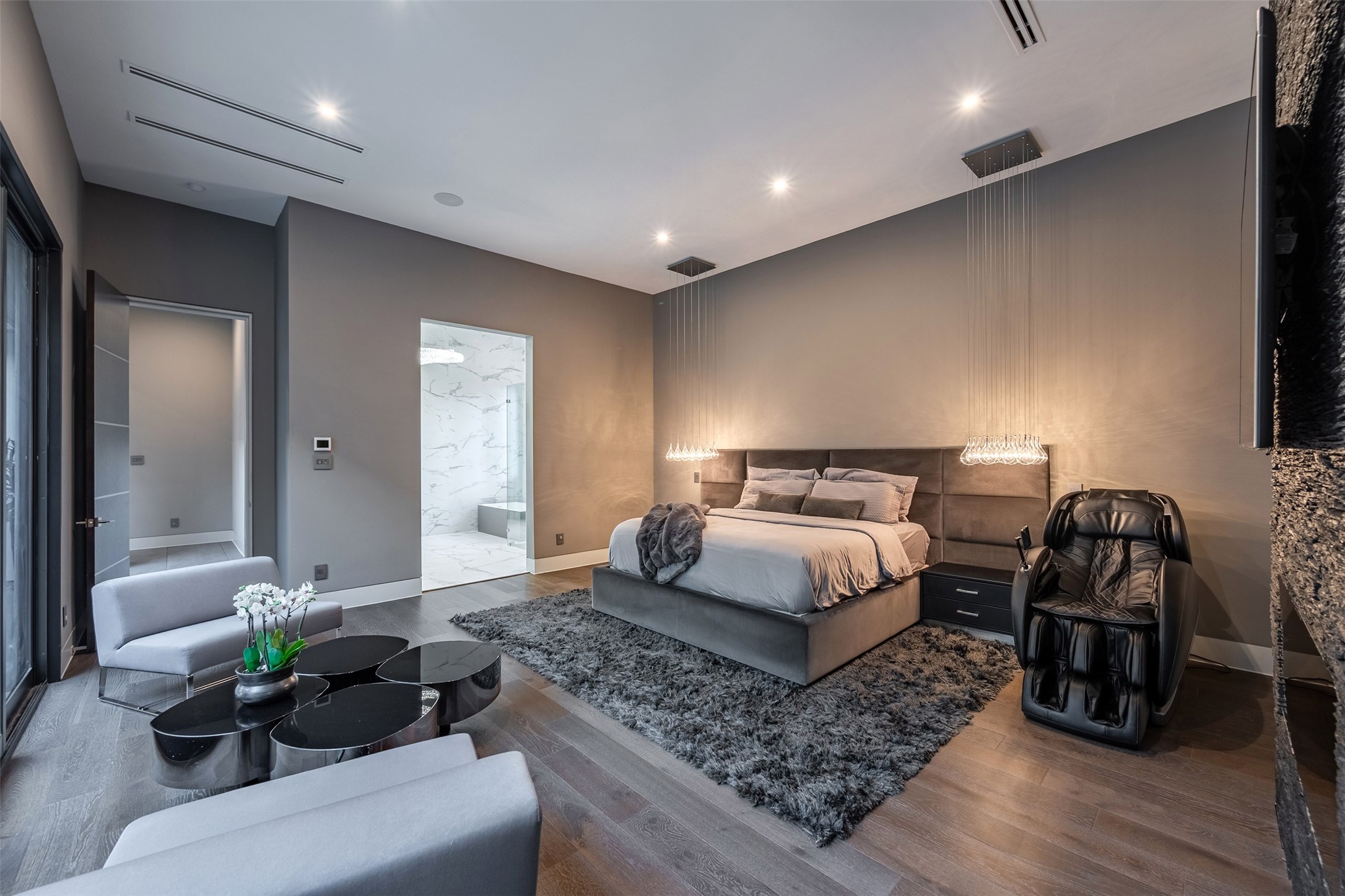 2302 Suffolk Drive Houston, TX 77027 - Photo 22 of 42 a bedroom with a bed and a couch