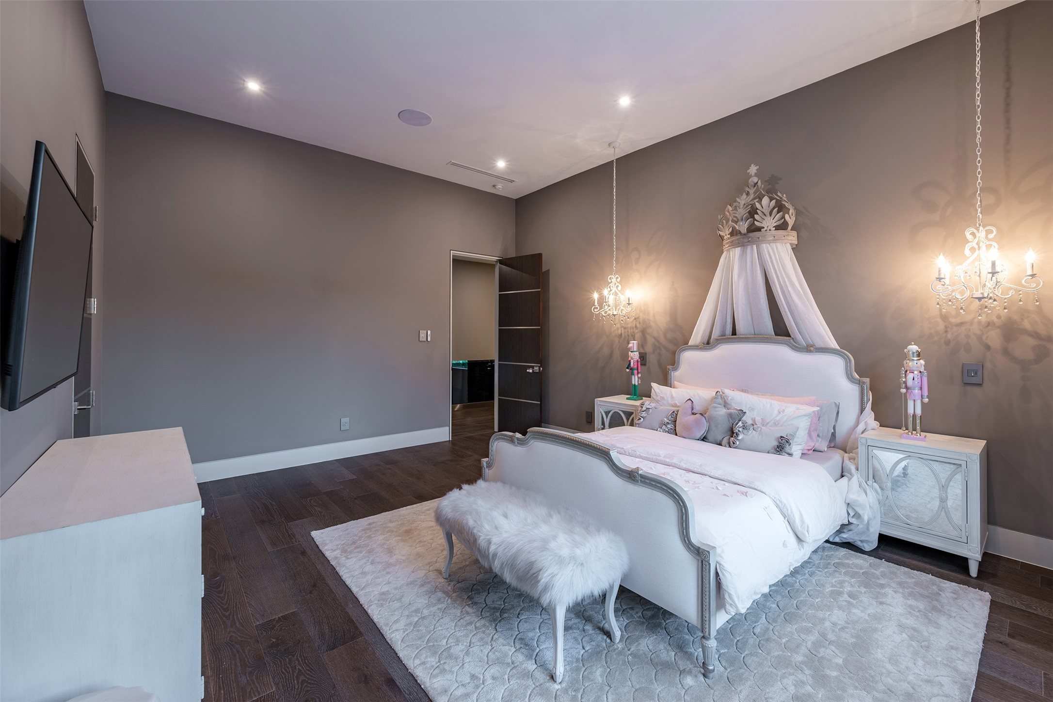 2302 Suffolk Drive Houston, TX 77027 - Photo 30 of 42 a bedroom with a bed and a flat screen tv