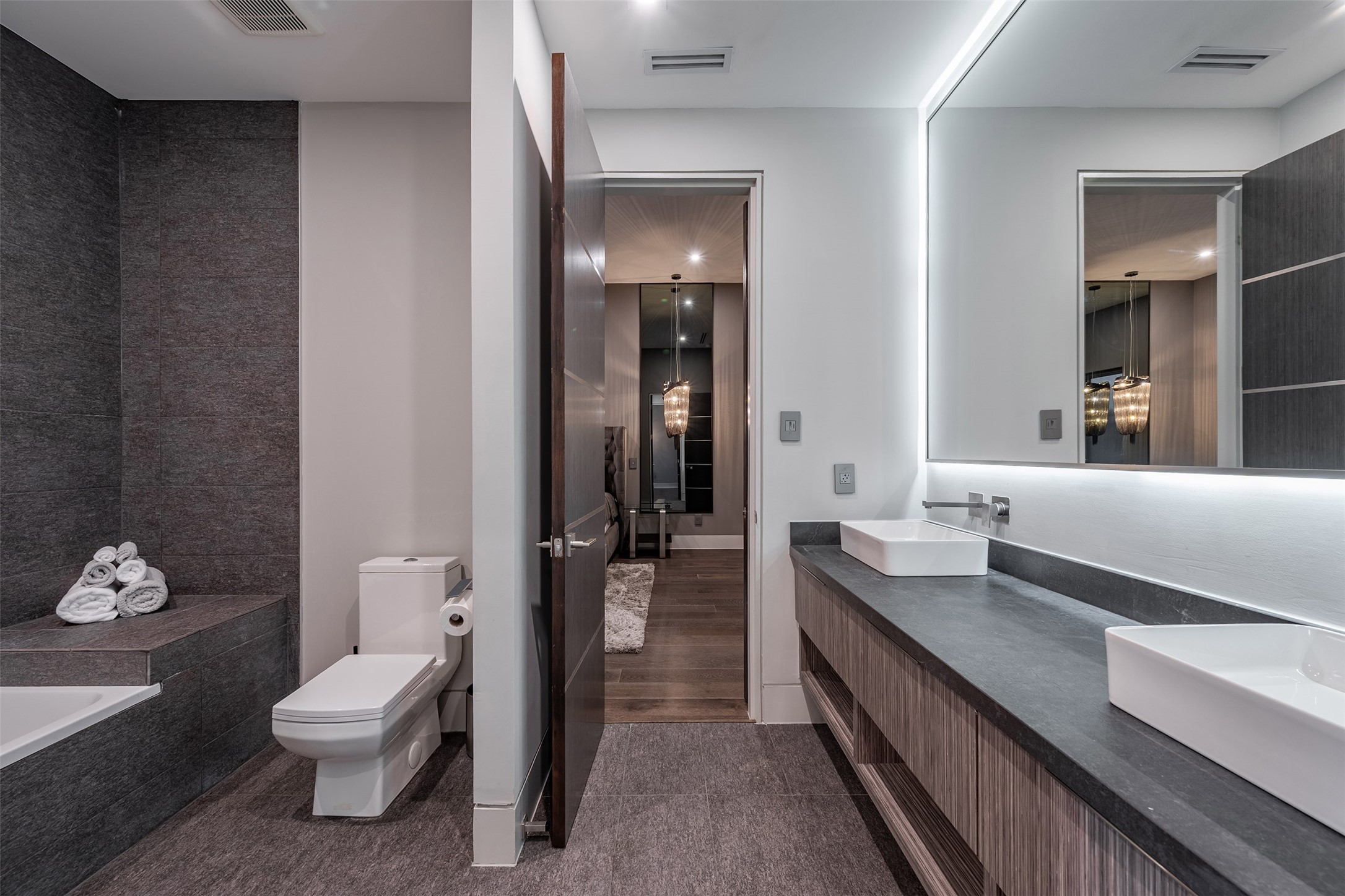 2302 Suffolk Drive Houston, TX 77027 - Photo 31 of 42 a bathroom with a double vanity sink toilet and shower