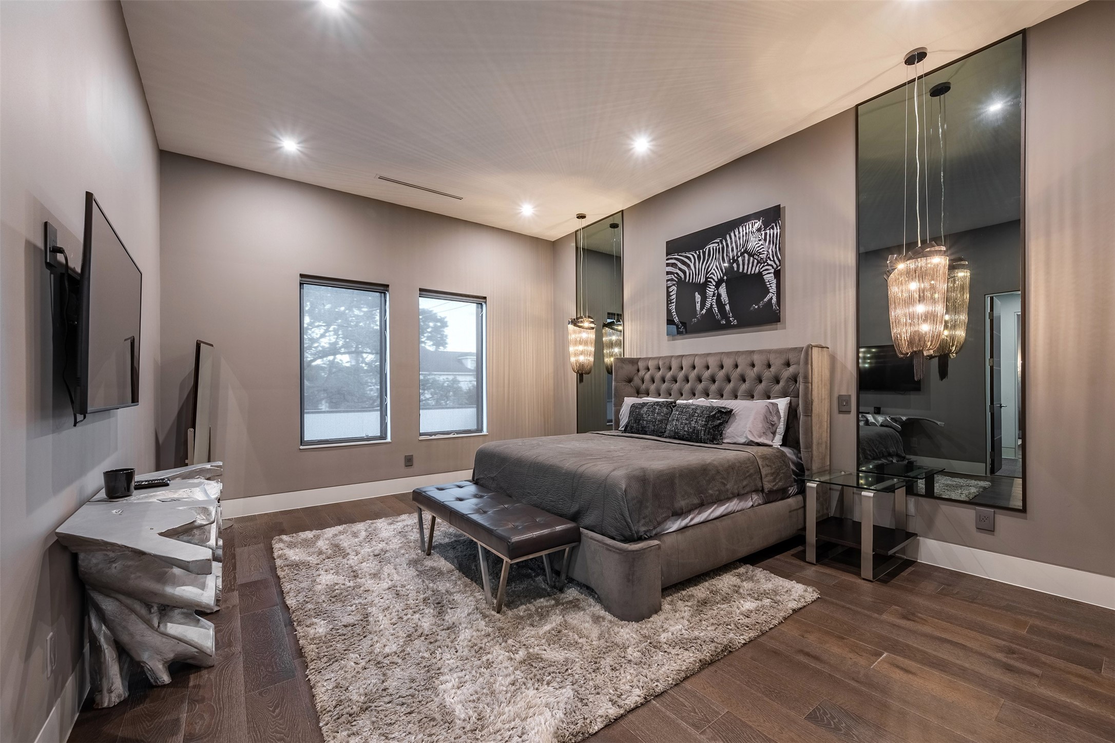 2302 Suffolk Drive Houston, TX 77027 - Photo 32 of 42 a spacious bedroom with a bed and a flat screen tv