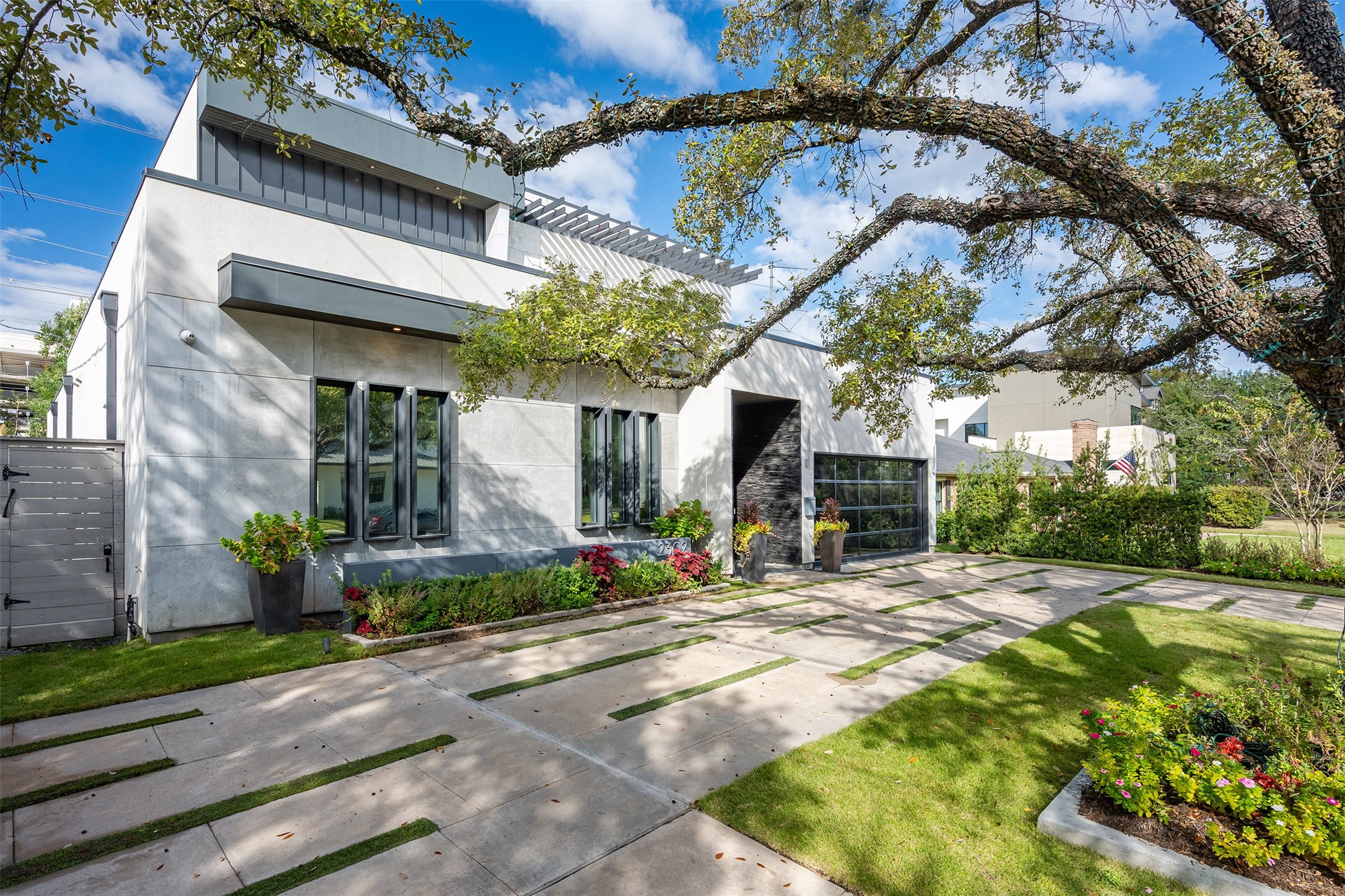 2302 Suffolk Drive Houston, TX 77027 - Photo 4 of 42 a view of a building with a yard