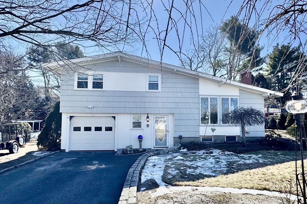 6 Redman Road Canton, MA 02021 - Photo 1 of 16 a front view of a house with garden