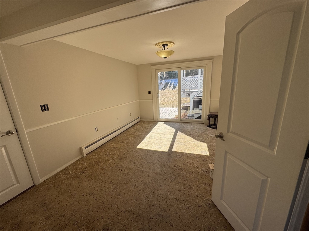 6 Redman Road Canton, MA 02021 - Photo 12 of 16 a view of a room with wooden floor and a window