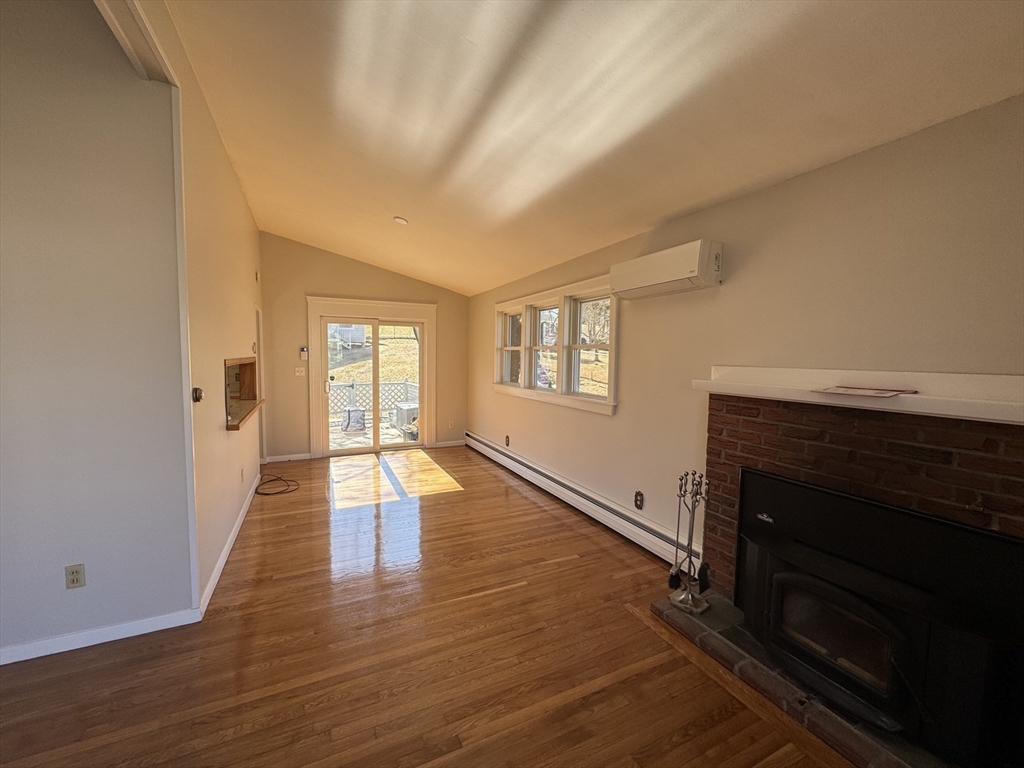 6 Redman Road Canton, MA 02021 - Photo 2 of 16 a view of an empty room with wooden floor and a window