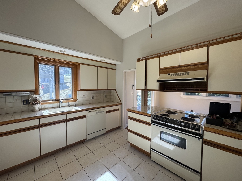 6 Redman Road Canton, MA 02021 - Photo 4 of 16 a kitchen with stainless steel appliances a stove sink and cabinets