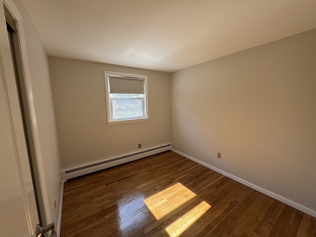 6 Redman Road Canton, MA 02021 - Photo 8 of 16 an empty room with wooden floor and windows