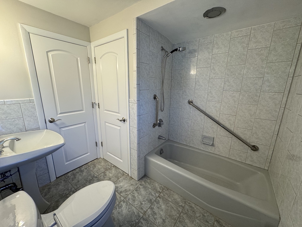 6 Redman Road Canton, MA 02021 - Photo 9 of 16 a bathroom with a sink a toilet and a bathtub