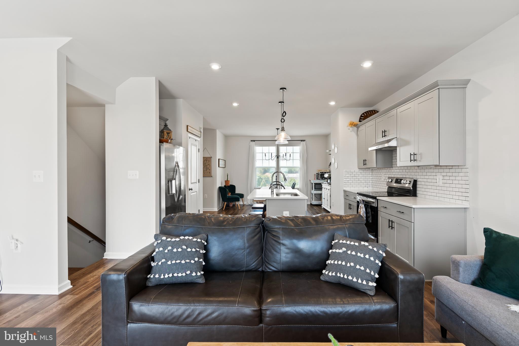163 Presidents Pointe Avenue Ranson, WV 25438 - Photo 15 of 40 Family room and kitchen view