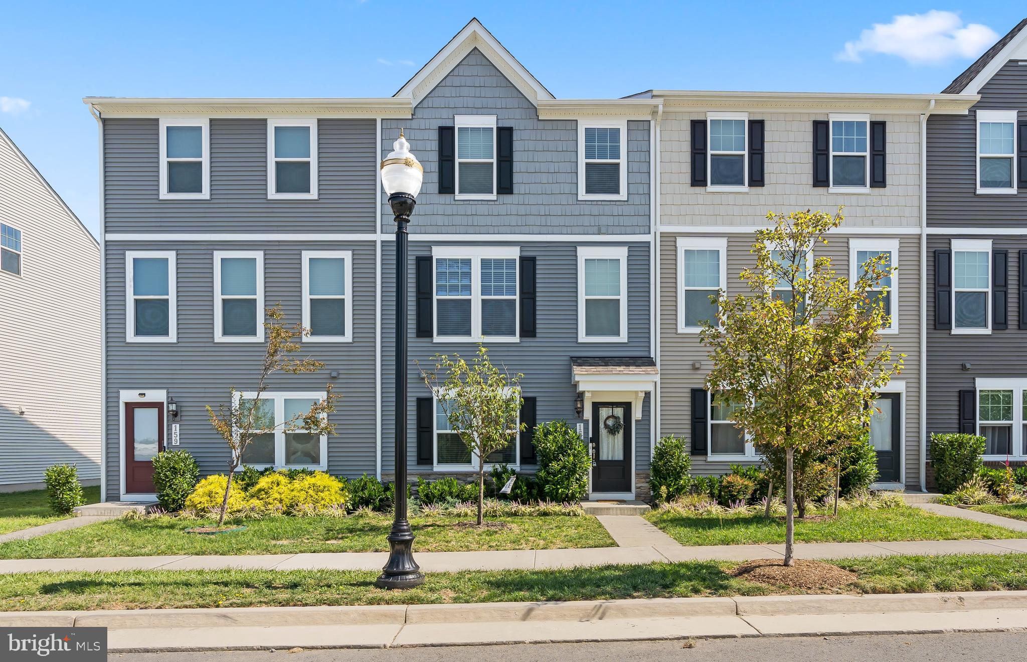 163 Presidents Pointe Avenue Ranson, WV 25438 - Photo 2 of 40 Shaker siding and stonework add character