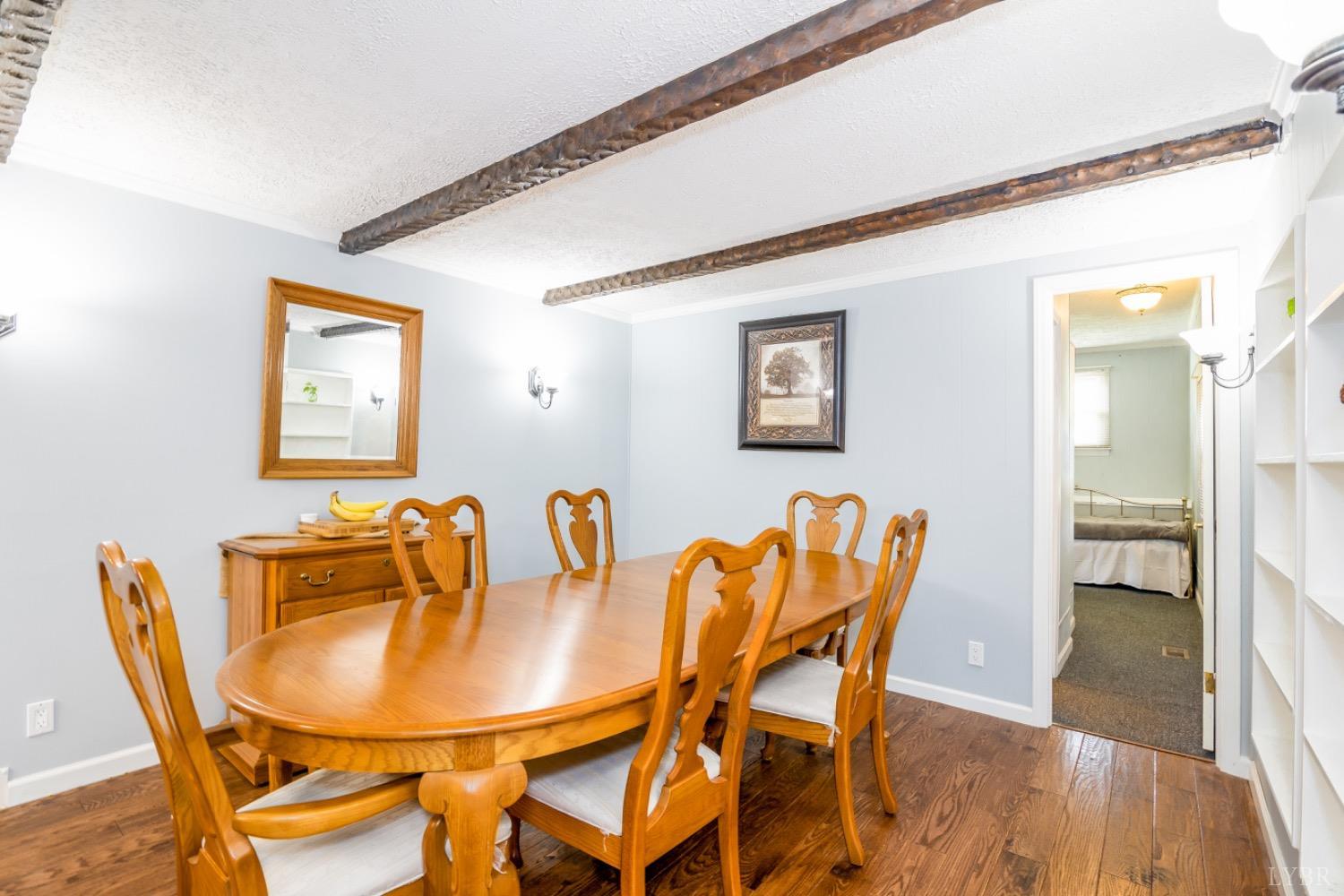 1097 Hummingbird Lane Spout Spring, VA 24593 - Photo 12 of 44 a view of a dining room with furniture and wooden floor