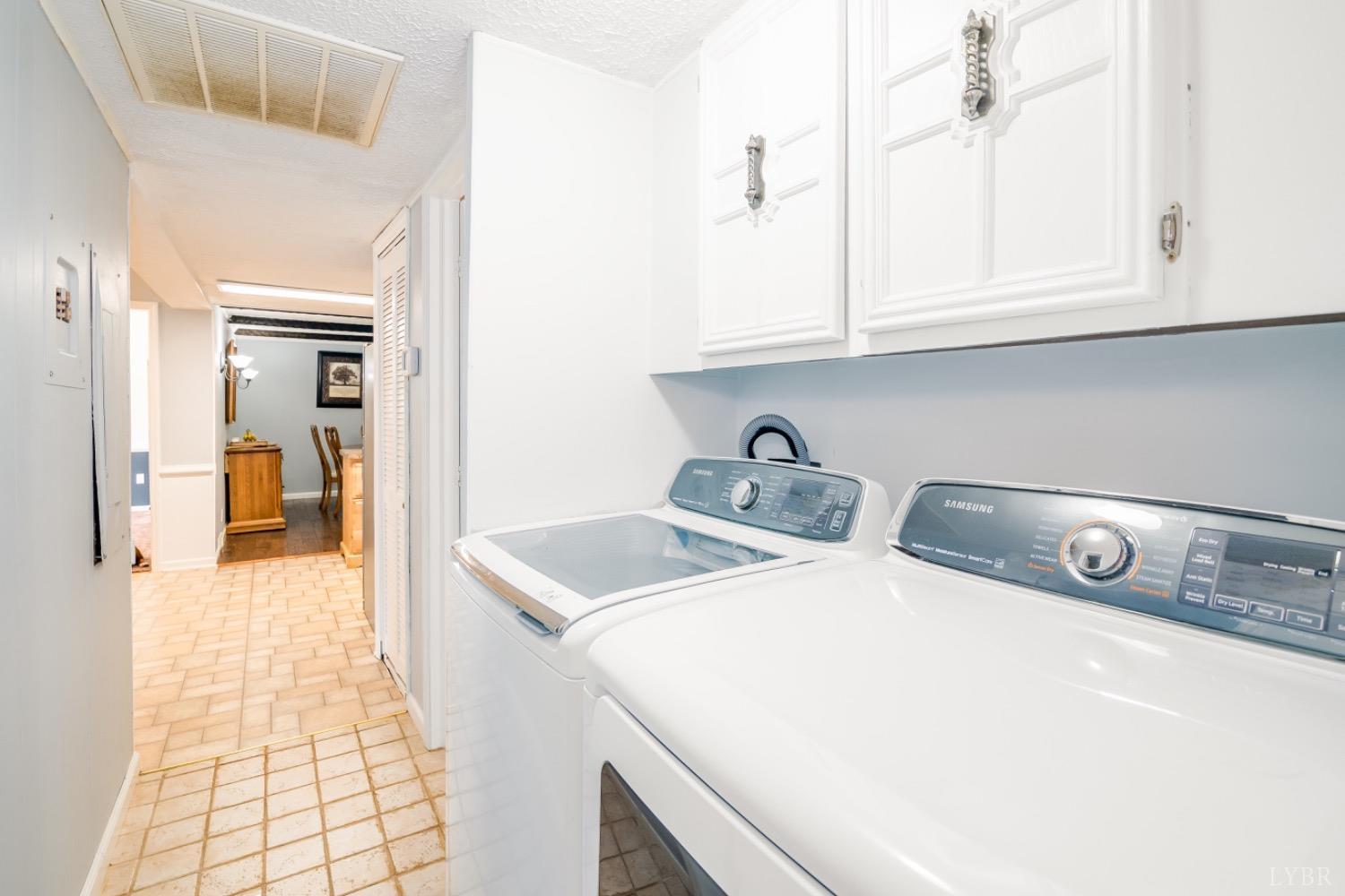 1097 Hummingbird Lane Spout Spring, VA 24593 - Photo 27 of 44 a utility room with dryer and washer