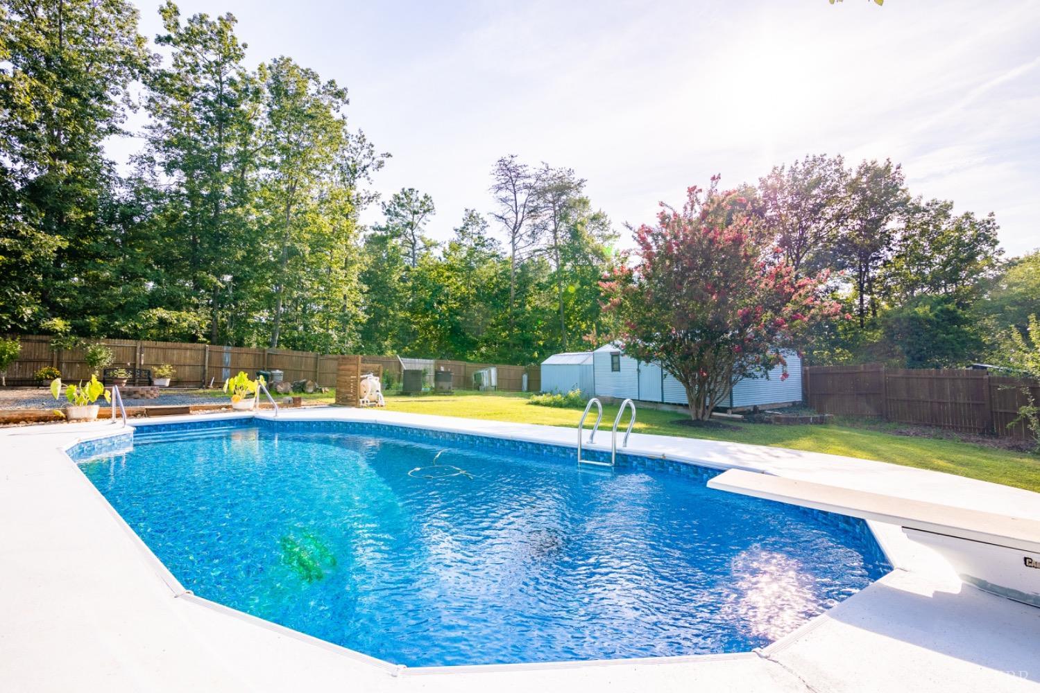 1097 Hummingbird Lane Spout Spring, VA 24593 - Photo 30 of 44 a view of a swimming pool with an outdoor space and seating area