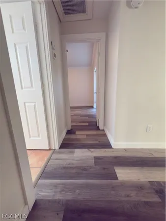a view of entryway with wooden floor