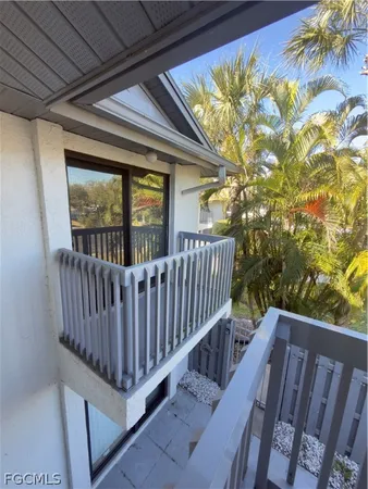 a view of balcony with wooden floor