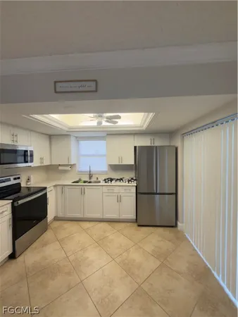 a kitchen with stainless steel appliances granite countertop a stove and a refrigerator