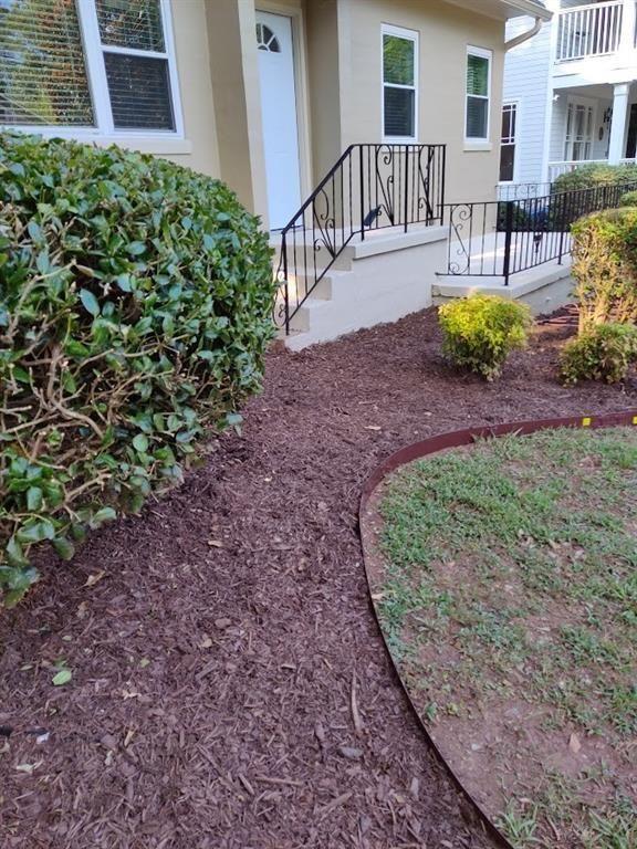 223 Sterling Street, Unit A Decatur, GA 30030 - Photo 1 of 36 a view of a backyard with table and chairs potted plants