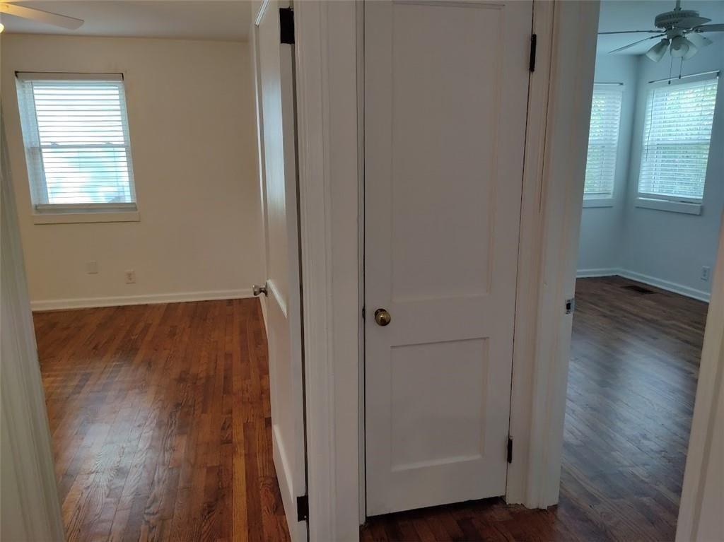 223 Sterling Street, Unit A Decatur, GA 30030 - Photo 15 of 36 an empty room with wooden floor and a window