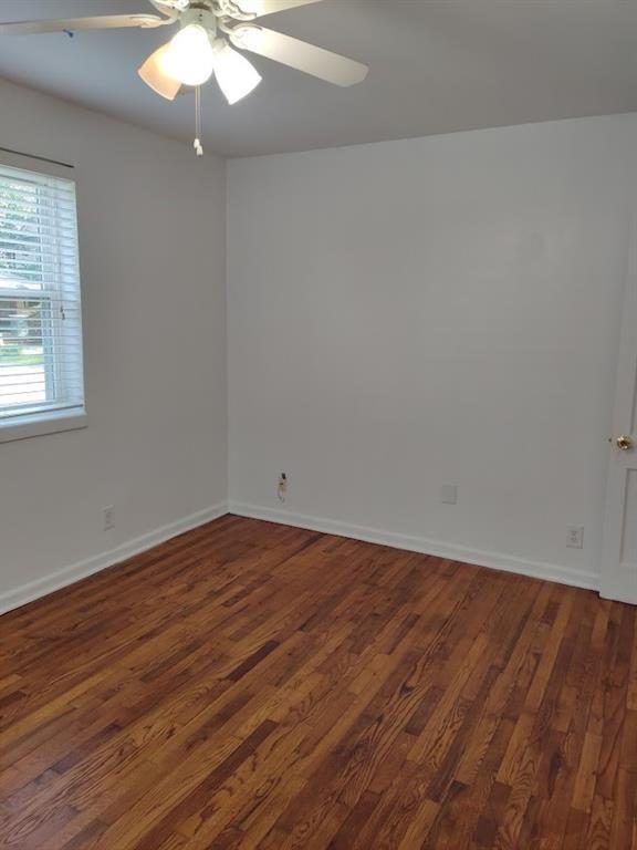 223 Sterling Street, Unit A Decatur, GA 30030 - Photo 16 of 36 an empty room with wooden floor and windows