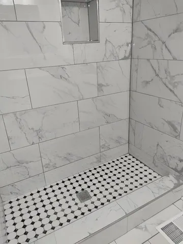 a bathroom with a glass door