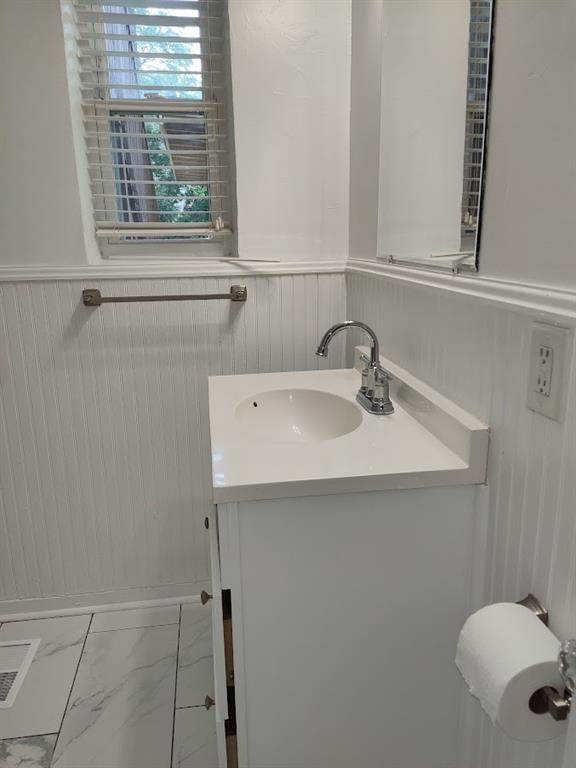 223 Sterling Street, Unit A Decatur, GA 30030 - Photo 22 of 36 a bathroom with a sink a window and a shower