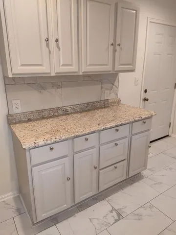 a view of cabinets and window