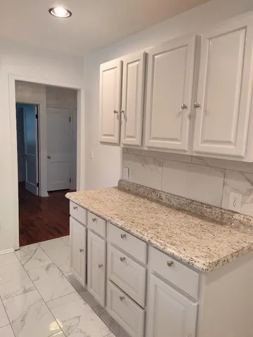 a kitchen with a sink and cabinets