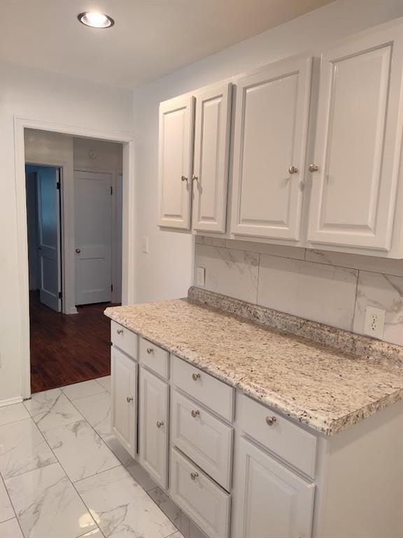 223 Sterling Street, Unit A Decatur, GA 30030 - Photo 31 of 36 a kitchen with granite countertop cabinets and sink