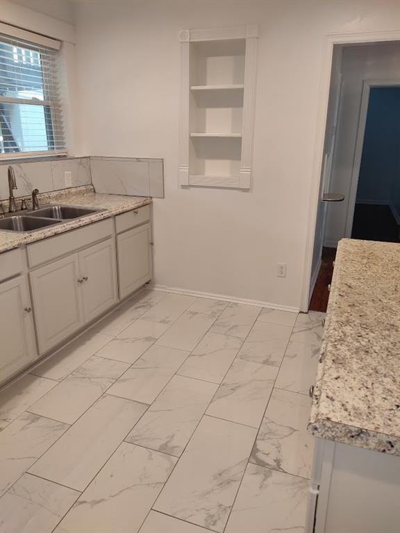 223 Sterling Street, Unit A Decatur, GA 30030 - Photo 33 of 36 a kitchen with a sink and cabinets