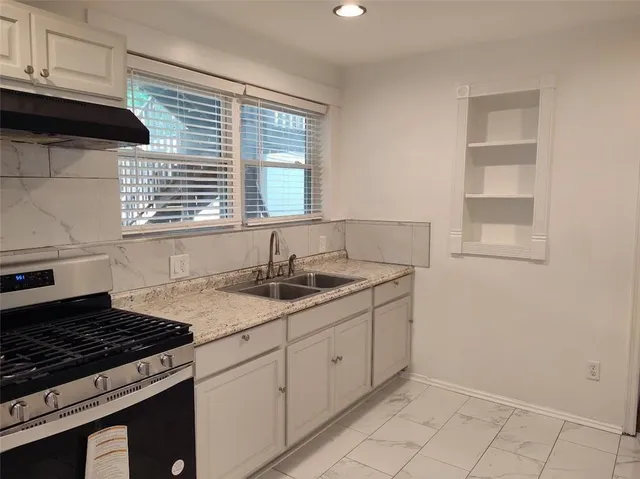 a front view of a house with garden and porch