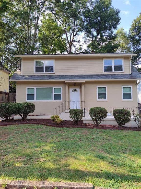 223 Sterling Street, Unit A Decatur, GA 30030 - Photo 36 of 36 a front view of a house with garden and porch