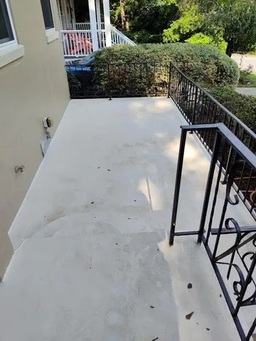 a view of balcony with wooden floor