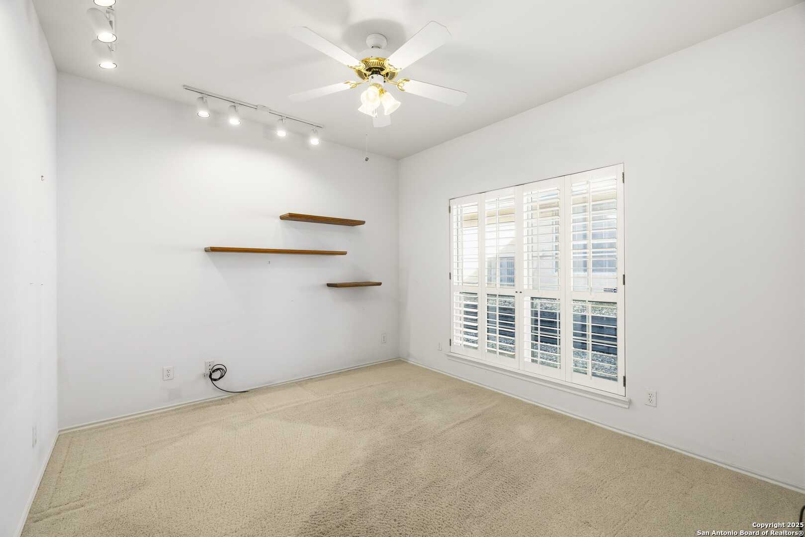 129 Los Cedros Loop Kerrville, TX 78028 - Photo 14 of 26 a view of an empty room with a window