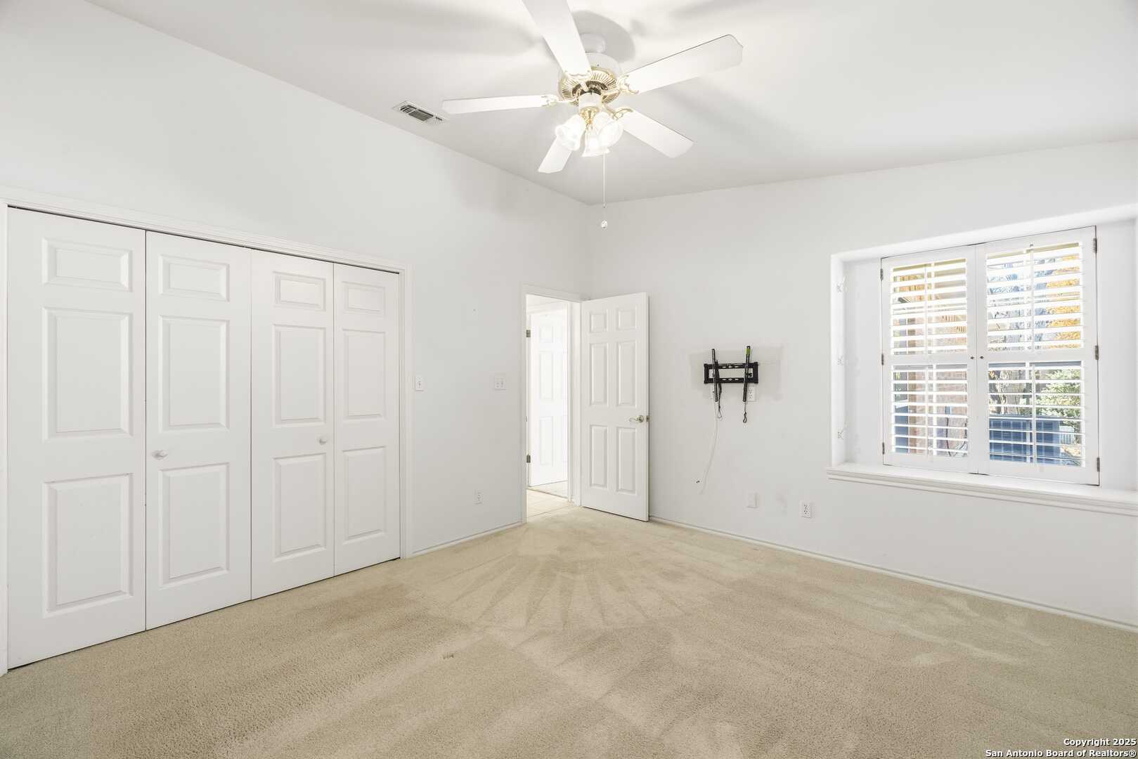 129 Los Cedros Loop Kerrville, TX 78028 - Photo 16 of 26 a view of an empty room with a window