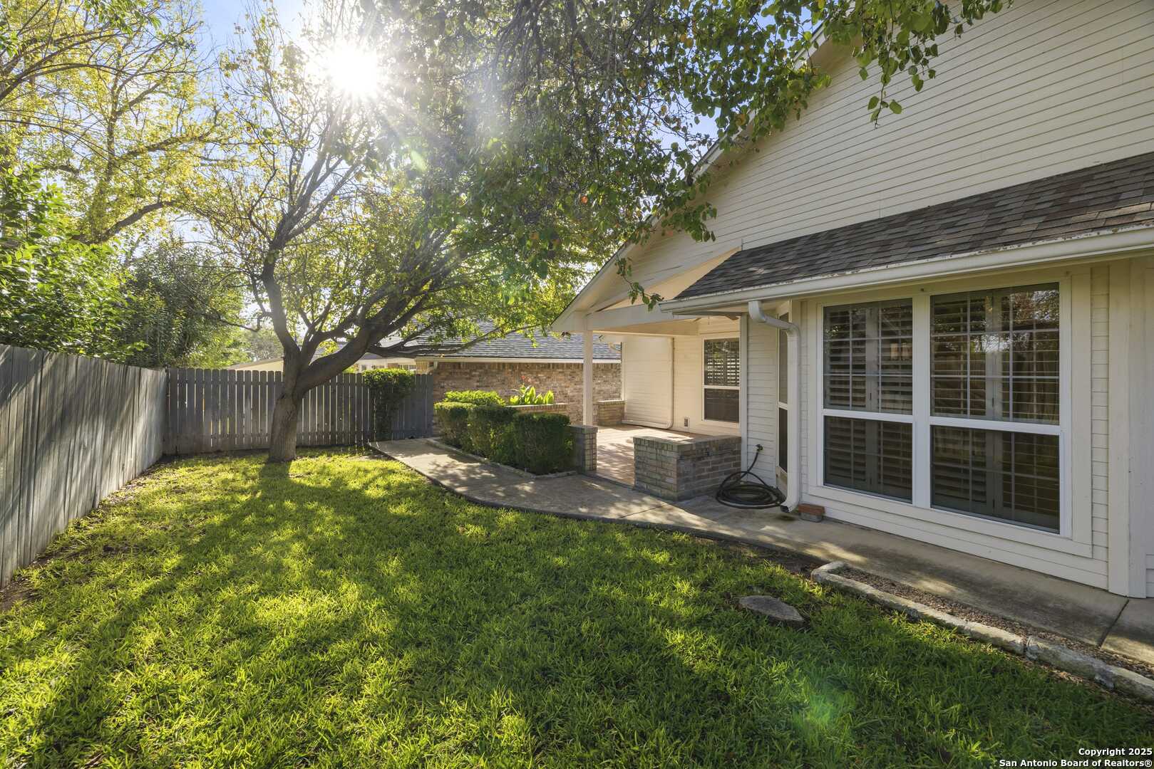 129 Los Cedros Loop Kerrville, TX 78028 - Photo 20 of 26 a backyard of a house with seating space